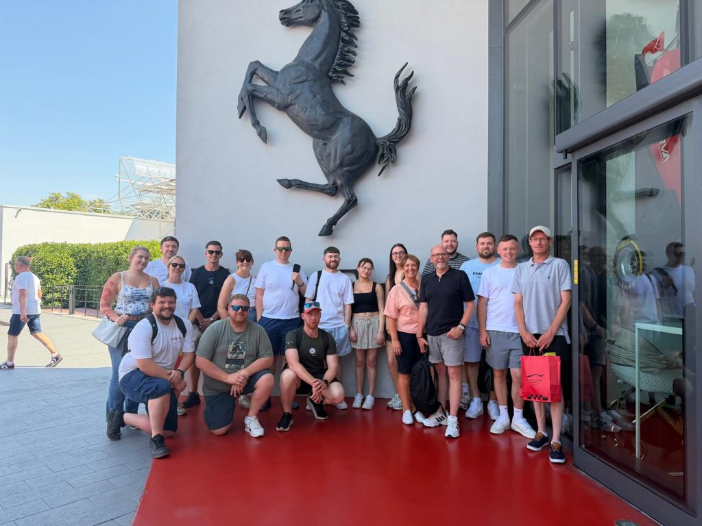Italia Rosso Grand Prize winners and guests outside the Ferrari Museum in Maranello, Italy.